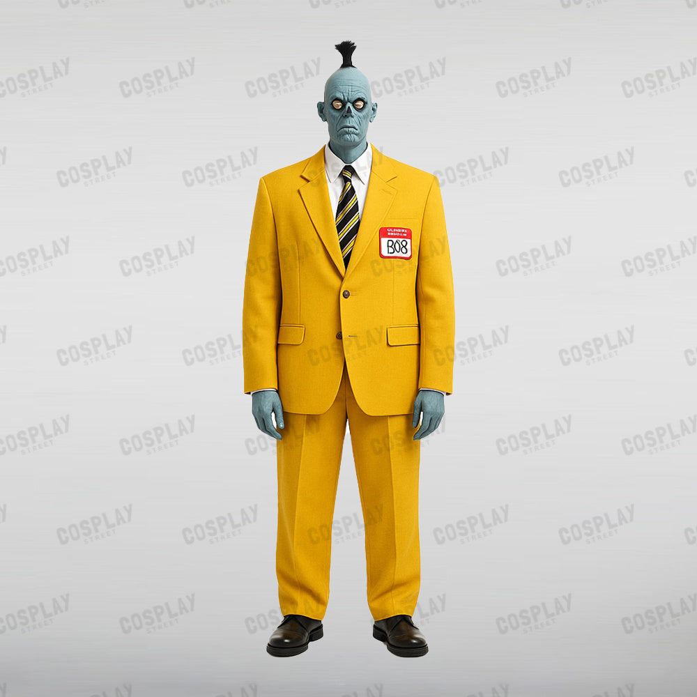 Beetlejuice Shrunken Head Bob in yellow suit and striped tie with name tag, standing with hands clasped.